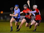 2 February 2023; Dara Purcell of UCD in action against Ger Millerick, centre, and Shane Barrett of UCC during the HE GAA Fitzgibbon Cup Group C match between University College Dublin and University College Cork at Billings Park in Belfield, Dublin. Photo by Seb Daly/Sportsfile