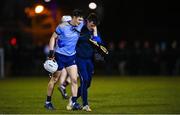 2 February 2023; David Crowe of UCD is helped from the pitch by physiotherapist Conor Duffy during the HE GAA Fitzgibbon Cup Group C match between University College Dublin and University College Cork at Billings Park in Belfield, Dublin. Photo by Seb Daly/Sportsfile