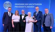 3 February 2023; The Mallon family of St Paul’s Lurgan, Armagh, from left, Dáire O Dubhthaigh, Philip Snr, Pat, and Philip Jnr, are presented with the Dermot Earley Family award by Uachtarán Chumann Lúthchleas Gael Larry McCarthy, second right, and AIB head of marketing engagement Nuala Kroondijk, second left, during the GAA President's Awards at Croke Park in Dublin. Photo by Seb Daly/Sportsfile
