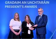 3 February 2023; International award recipient Joan Henchy, New York GAA, centre, is presented with her award by Uachtarán Chumann Lúthchleas Gael Larry McCarthy and AIB head of marketing engagement Nuala Kroondijk during the GAA President's Awards at Croke Park in Dublin. Photo by Seb Daly/Sportsfile