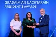 3 February 2023; Gradam na Gaeilge recipient Bronagh Lennon of CLG Naomh Muire Achadh Gallan, Aontroim, centre, is presented with her award by Uachtarán Chumann Lúthchleas Gael Larry McCarthy and AIB head of marketing engagement Nuala Kroondijk during the GAA President's Awards at Croke Park in Dublin. Photo by Seb Daly/Sportsfile