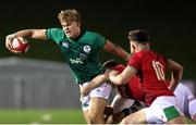 3 February 2023; Hugh Gavin of Ireland in action against Tom Florence of Wales during the U20 Six Nations Rugby Championship match between Wales and Ireland at Stadiwm CSM in Colwyn Bay, Wales. Photo by Paul Greenwood/Sportsfile