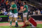 3 February 2023; James Nicholson of Ireland celebrates his try with Sam Prendergast and Gus McCarthy during the U20 Six Nations Rugby Championship match between Wales and Ireland at Stadiwm CSM in Colwyn Bay, Wales. Photo by Paul Greenwood/Sportsfile