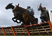 4 February 2023; Gala Marceau, centre, with Danny Mullins up, jumps the first on their way to winning the Donohue Marquees Spring Juvenile Hurdle, from eventual second place Lossiemouth, right, with Paul Townend up, on day one of the Dublin Racing Festival at Leopardstown Racecourse in Dublin. Photo by Seb Daly/Sportsfile