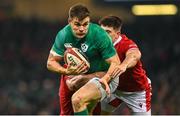 4 February 2023; Garry Ringrose of Ireland is tackled by Tomas Francis and Joe Hawkins, right, of Wales during the Guinness Six Nations Rugby Championship match between Wales and Ireland at Principality Stadium in Cardiff, Wales. Photo by Brendan Moran/Sportsfile