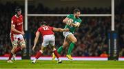 4 February 2023; Stuart McCloskey of Ireland escapes the tackle of Joe Hawkins of Wales during the Guinness Six Nations Rugby Championship match between Wales and Ireland at Principality Stadium in Cardiff, Wales. Photo by Brendan Moran/Sportsfile