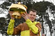 4 February 2023; Jockey Paul Townend celebrates with the Paddy Power Irish Gold Cup after riding Galopin Des Champs to victory in the Paddy Power Irish Gold Cup the Paddy Power Irish Gold Cup on day one of the Dublin Racing Festival at Leopardstown Racecourse in Dublin. Photo by Seb Daly/Sportsfile