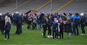 4 February 2023; Spectators on the pitch after they were moved out of the main stand due to a small fire before the Allianz Hurling League Division 1 Group A match between Wexford and Galway at Chadwicks Wexford Park in Wexford. Photo by Piaras Ó Mídheach/Sportsfile