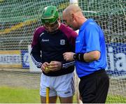 4 February 2023; Referee John Keenan in conversation with Galway goalkeeper Éanna Murphy before the Allianz Hurling League Division 1 Group A match between Wexford and Galway at Chadwicks Wexford Park in Wexford. Photo by Piaras Ó Mídheach/Sportsfile