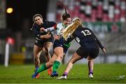 4 February 2023; Maeve Liston of Combined Provinces XV skips past the tackles of Francesca McGhie, left, and Holly McIntyre of The Thistles during the Celtic Challenge 2023 match between Combined Provinces XV and The Thistles at Kingspan Stadium in Belfast. Photo by Ben McShane/Sportsfile