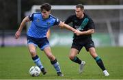 4 February 2023; Dara Keane of UCD in action against Liam Burt of Shamrock Rovers during the Leinster Senior Cup fourth round match between UCD and Shamrock Rovers at UCD Bowl in Dublin. Photo by Tyler Miller/Sportsfile