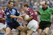6 June 2004; Fergal Wilson, Westmeath, in action against Barry Cahill, Dublin, as referee Michael Collins gets close to the action. Bank of Ireland Leinster Senior Football Championship, Dublin v Westmeath, Croke Park, Dublin. Picture credit; David Maher / SPORTSFILE