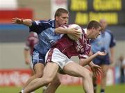 6 June 2004; Gary Dolan, Westmeath, is tackled by Conal Keaney, Dublin. Bank of Ireland Leinster Senior Football Championship, Dublin v Westmeath, Croke Park, Dublin. Picture credit; Matt Browne / SPORTSFILE