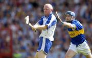 6 June 2004; John Mullane, Waterford, scores his sides third goal despite the attentions of Paul Kelly, Tipperary. Guinness Munster Senior Hurling Championship semi-final, Tipperary v Waterford, Pairc Ui Chaoimh, Cork. Picture credit; Brendan Moran / SPORTSFILE