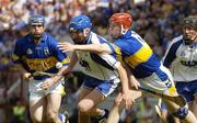 6 June 2004; Declan Prendergast, Waterford, in action against Paddy O'Brien, Tipperary. Guinness Munster Senior Hurling Championship Semi-Final, Tipperary v Waterford, Pairc Ui Chaoimh, Cork. Picture credit; Pat Murphy / SPORTSFILE