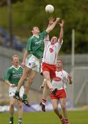 6 June 2004; Gavin Devlin, Tyrone, contests a high ball with Fermanagh's James Sherry. Bank of Ireland Ulster Senior Football Championship, Tyrone v Fermanagh, St. Tighernach's Park, Clones, Co. Monaghan. Picture credit; Damien Eagers / SPORTSFILE