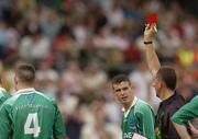 6 June 2004; Referee Seamus McCormack issues the red card to Fermanagh's Hugh Brady,(4). Bank of Ireland Ulster Senior Football Championship, Tyrone v Fermanagh, St. Tighernach's Park, Clones, Co. Monaghan. Picture credit; Damien Eagers / SPORTSFILE