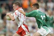 6 June 2004; Philip Jordan, Tyrone, in action against Mark Little, Fermanagh. Bank of Ireland Ulster Senior Football Championship, Tyrone v Fermanagh, St. Tighernach's Park, Clones, Co. Monaghan. Picture credit; Damien Eagers / SPORTSFILE