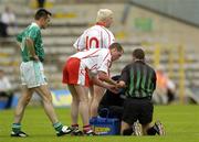 6 June 2004; Referee Seamus McCormack is attended to by Tyrone's Gavin Devlin after taking a fall. Bank of Ireland Ulster Senior Football Championship, Tyrone v Fermanagh, St. Tighernach's Park, Clones, Co. Monaghan. Picture credit; Damien Eagers / SPORTSFILE