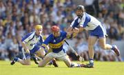 6 June 2004; John Devane, Tipperary, in action against Eoin Murphy, left, and James Murray, Waterford. Guinness Munster Senior Hurling Championship semi-final, Tipperary v Waterford, Pairc Ui Chaoimh, Cork. Picture credit; Brendan Moran / SPORTSFILE