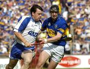 6 June 2004; Paul Flynn, Waterford, in action against Tipperary's Paul Curran. Guinness Munster Senior Hurling Championship Semi-Final, Tipperary v Waterford, Pairc Ui Chaoimh, Cork. Picture credit; Pat Murphy / SPORTSFILE