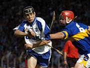 6 June 2004; Shane O'Sullivan, Waterford, in action against Tipperary's Diarmuid Fitzgerald. Guinness Munster Senior Hurling Championship Semi-Final, Tipperary v Waterford, Pairc Ui Chaoimh, Cork. Picture credit; Pat Murphy / SPORTSFILE