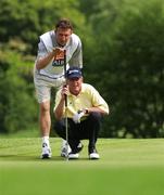 6 June 2004; Carl Mason, England, eventual winner, receives advice from his caddy Stewart Case on the 18th green during the final round of the AIB Irish Seniors Open. Adare Manor Hotel Golf and Country Club, Adare, Co. Limerick. Picture credit; SPORTSFILE