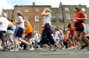 7 June 2004; Some of the thousands of runners make their way along Fitzwillian Square during the 2004 Flora Women's Mini-Marathon. Dublin. Picture credit; Brendan Moran / SPORTSFILE