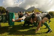 8 June 2004; David Wallace gets in some scrum practice with Table Mountin in the background during Ireland rugby squad training. The Villages Rugby Ground, Capetown, South Africa. Picture credit; Matt Browne / SPORTSFILE