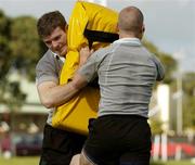 8 June 2004; Gordon D'Arcy, left, and Peter Stringer in action during Ireland rugby squad training. The Villages Rugby Ground, Capetown, South Africa. Picture credit; Matt Browne / SPORTSFILE