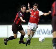 8 June 2004; Des Byrne, St. Patrick's Athletic, in action against John Martin, Longford Town. eircom League, Premier Division, Richmond Park, Dublin. Picture credit; Brian Lawless / SPORTSFILE