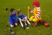9 June 2004; Frankie De Paor, 12 years, and Cormac Diamond, 12, both from Belgrove Senior Boys, Clontarf, Dublin, with Ronald McDonald at the Dublin final of the McDonalds Lift & Strike Competition. Parnell Park, Dublin. Picture credit; Ray McManus / SPORTSFILE
