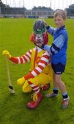 9 June 2004; Stiofan O'Cathasaign, 11 years, Scoil an Tseachtar Laoch, Ballymun, Dublin, with Ronald McDonald at the Dublin final of the McDonalds Lift & Strike Competition. Parnell Park, Dublin. Picture credit; Ray McManus / SPORTSFILE