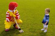 9 June 2004; Conor Berrigan, 3 years, from Finglas, Dublin, in conversation with Ronald McDonald, as the Dublin final of the McDonalds Lift & Strike Competition continues. Parnell Park, Dublin. Picture credit; Ray McManus / SPORTSFILE