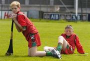 9 June 2004; Glen Carroll, left, 13 years, and Dean Flood, 12 years, both of Scoil Eoin, await their turn at the Dublin final of the McDonalds Lift & Strike Competition. Parnell Park, Dublin. Picture credit; Pat Murphy / SPORTSFILE