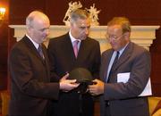 10 June 2004; Denis Egan, left, Chief Executive, The Turf Club, Pierce G Molony, centre, Senior Steward, The Turf Club, and Ivo O'Sullivan, Chairman, Safety Review Group, view a standard helmet at the announcement of the Safety Review Group Report and Recommendations published by The Turf Club. The Westbury Hotel, Dublin. Picture credit; Brian Lawless / SPORTSFILE