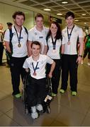 20 August 2013; The Irish squad, sponsored by Allianz, return from the 2013 Paralympic World Swimming Championships in Canada. The team secured an impressive eight medals ensuring that it was Ireland's best ever performance at the Paralympic World Swimming Championships. Pictured are members of Irish squad including Gold medallist Darragh McDonald, left, from Gorey, Co. Wexford, Jonathan McGrath, from Killaloe, Co. Clare, Ellen Keane, from Clontarf, Dublin, who won two Bronze medals, Laurence McGivern, right, from Rostrevor, Co. Down, and James Scully, from Ratoath, Co. Meath, who won a Bronze medal apiece. Dublin Airport, Dublin. Picture credit: Ray McManus / SPORTSFILE