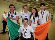 20 August 2013; The Irish squad, sponsored by Allianz, return from the 2013 Paralympic World Swimming Championships in Canada. The team secured an impressive eight medals ensuring that it was Ireland's best ever performance at the Paralympic World Swimming Championships. Pictured are members of Irish squad including Gold medallist Darragh McDonald, left, from Gorey, Co. Wexford, Jonathan McGrath, from Killaloe, Co. Clare, Ellen Keane, from Clontarf, Dublin, who won two Bronze medals, Laurence McGivern, right, from Rostrevor, Co. Down, and James Scully, from Ratoath, Co. Meath, who won a Bronze medal apiece. Dublin Airport, Dublin. Picture credit: Ray McManus / SPORTSFILE