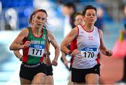 5 February 2023; Paula Donnellan Walsh of Mayo AC, Mayo, left, and Patricia Lee of North Sligo AC, Sligo, competing in the Women's F50 1500m during the 123.ie National Masters Indoor Championships at the TUS International arena in Athlone, Westmeath. Photo by Ben McShane/Sportsfile