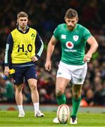 4 February 2023; Jack Crowley of Ireland looks on as teammate Ross Byrne prepares to kick a conversion during the Guinness Six Nations Rugby Championship match between Wales and Ireland at Principality Stadium in Cardiff, Wales. Photo by Brendan Moran/Sportsfile