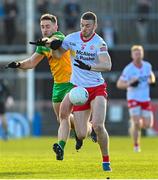 5 February 2023; Brian Kennedy of Tyrone in action against Hugh McFadden of Donegal during the Allianz Football League Division 1 match between Tyrone and Donegal at O'Neill's Healy Park in Omagh, Tyrone. Photo by Ramsey Cardy/Sportsfile
