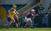5 February 2023; Jack Galvin of Westmeath is tackled by Ian Galvin, 12, and David Fitzgerald of Clare during the Allianz Hurling League Division 1 Group A match between Clare and Westmeath at Cusack Park in Ennis, Clare. Photo by Ray McManus/Sportsfile
