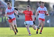 5 February 2023; Conall McKeever of Louth in action against Padraig McGrogan and Conor McCluskey of Derry during the Allianz Football League Division 2 match between Louth and Derry at DEFY Pairc Mhuire in Ardee, Louth. Photo by Stephen Marken/Sportsfile