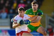 5 February 2023; Cormac Quinn of Tyrone in action against Caolan McGonagle of Donegal during the Allianz Football League Division 1 match between Tyrone and Donegal at O'Neill's Healy Park in Omagh, Tyrone. Photo by Ramsey Cardy/Sportsfile