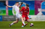 5 February 2023; Darragh O'Shea of Cork Youth League is tackled by Ben Costelloe of Galway District League during the FAI Youth Inter-League Cup Final 2023 match between Galway District League and Cork Youth League at Eamonn Deacy Park in Galway. Photo by Tyler Miller/Sportsfile