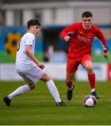 5 February 2023; Sean Connolly of Cork Youth League in action against Scott Dillon of Galway District League during the FAI Youth Inter-League Cup Final 2023 match between Galway District League and Cork Youth League at Eamonn Deacy Park in Galway. Photo by Tyler Miller/Sportsfile