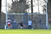 5 February 2023; Shane McGuigan of Derry scores a penalty past Martin McEneaney of Louth during the Allianz Football League Division 2 match between Louth and Derry at DEFY Pairc Mhuire in Ardee, Louth. Photo by Stephen Marken/Sportsfile