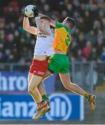 5 February 2023; Cathal McShane of Tyrone in action against Brendan McCole of Donegal during the Allianz Football League Division 1 match between Tyrone and Donegal at O'Neill's Healy Park in Omagh, Tyrone. Photo by Ramsey Cardy/Sportsfile