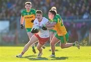 5 February 2023; Peter Harte of Tyrone is tackled by Martin O'Reilly of Donegal during the Allianz Football League Division 1 match between Tyrone and Donegal at O'Neill's Healy Park in Omagh, Tyrone. Photo by Ramsey Cardy/Sportsfile