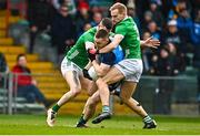 5 February 2023; Con O’Callaghan of Dublin is tackled by Séan O'Dea, right, and Iain Corbett of Limerick during the Allianz Football League Division 2 match between Limerick and Dublin at TUS Gaelic Grounds in Limerick. Photo by Sam Barnes/Sportsfile
